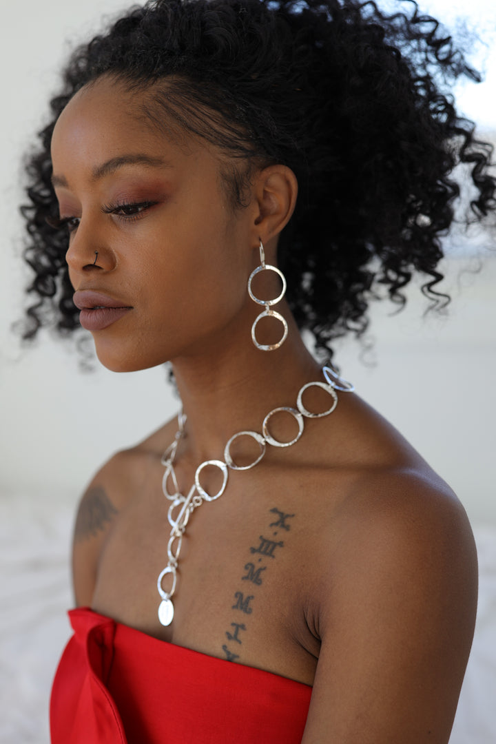 Open Twin Pounded Silver Circle Earrings on Model