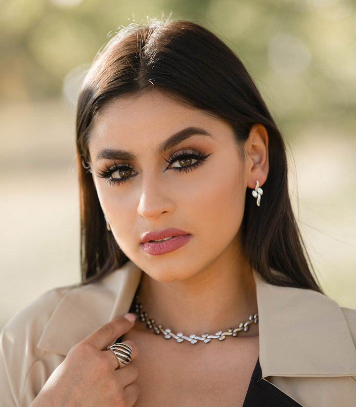 Oval and Wavy Silver Post Earrings on Model