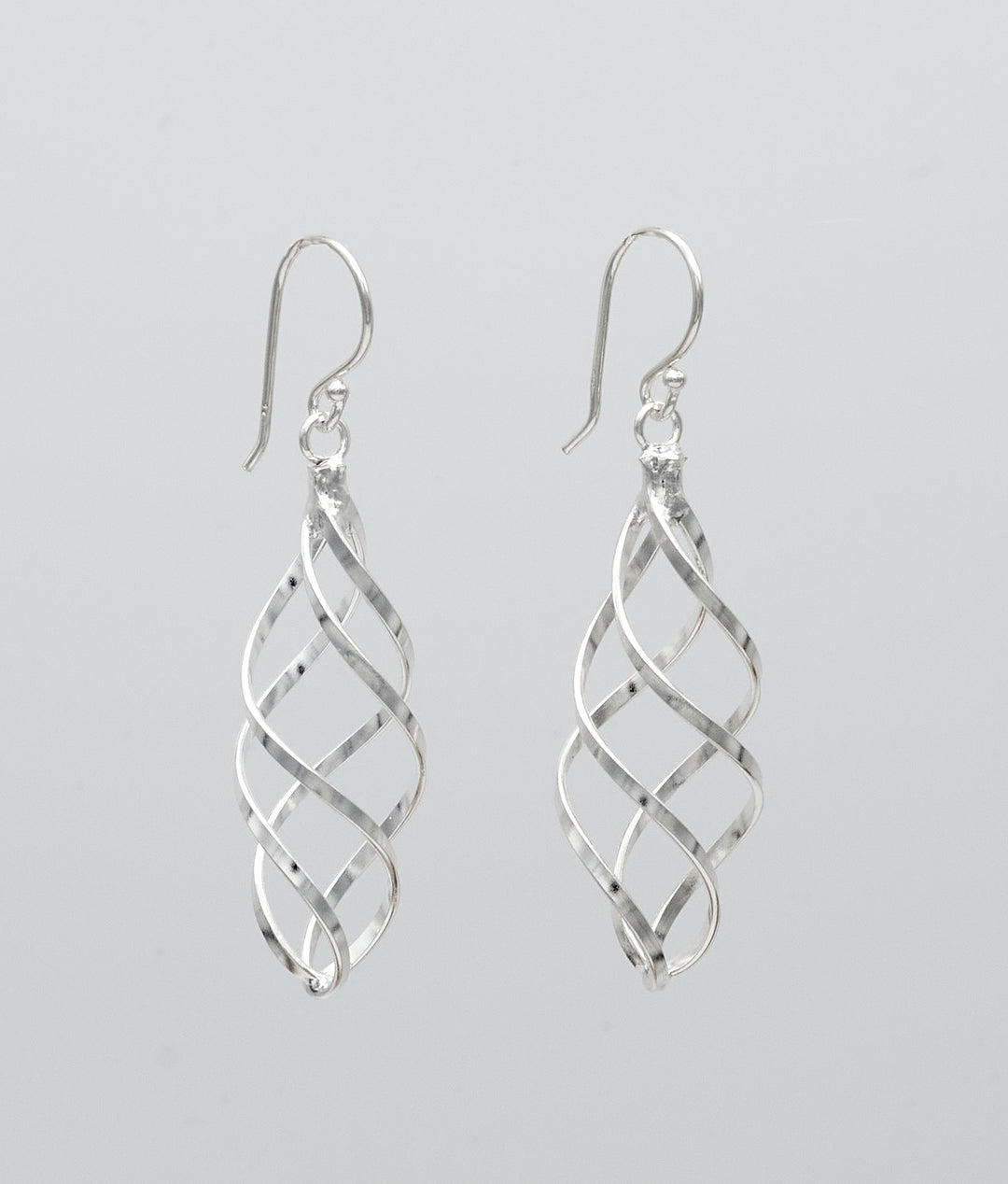 Swirled marquise sterling silver dangle earrings with a polished finish by Renata Rubio 92.5