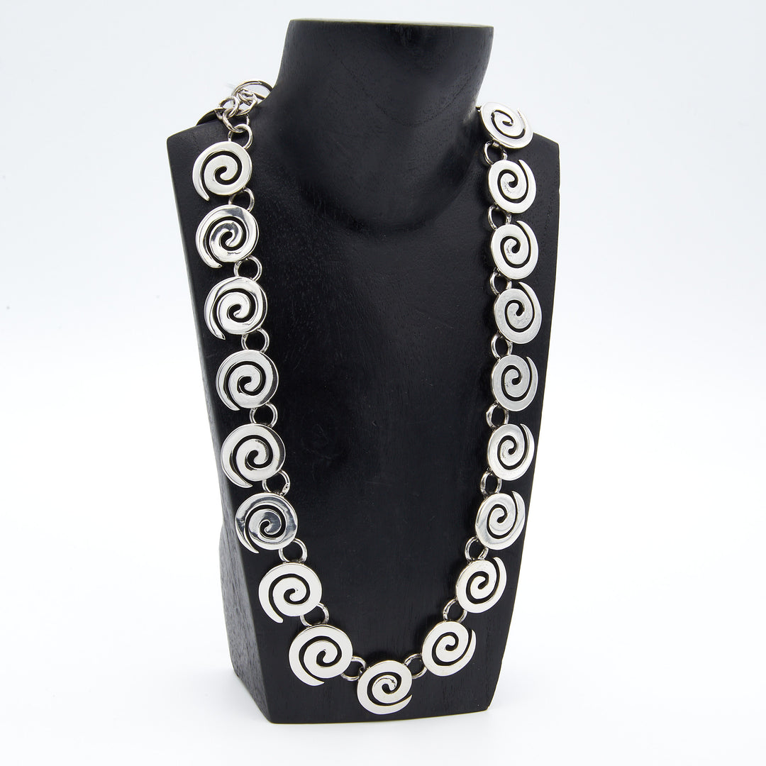 Coiled sterling silver necklace by Renata Rubio 92.5 – handcrafted, high-polish silver with a secure T-toggle closure.