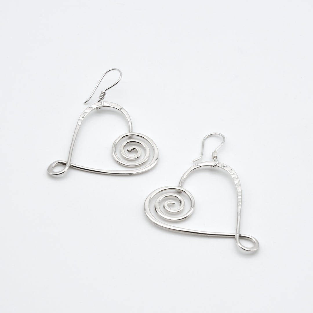 Sterling silver heart earrings with pounded and coiled details by Renata Rubio 92.5