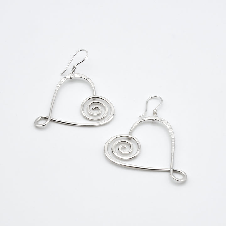 Sterling silver heart earrings with pounded and coiled details by Renata Rubio 92.5