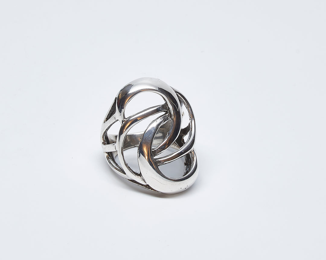 Silver swirl wax cast ring by Renata Rubio 92.5 – handcrafted, sculptural sterling silver jewelry with a bold curved design.