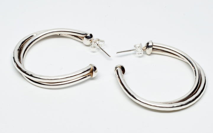 Double Twist Silver Hoop Earrings - Renata Rubio 92.5 - Handmade sterling silver jewelry with a lifetime warranty.