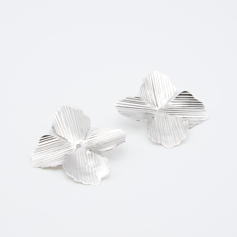 Renata Rubio 92.5 four-petal sterling silver post earrings with delicate lined texture and floral design.