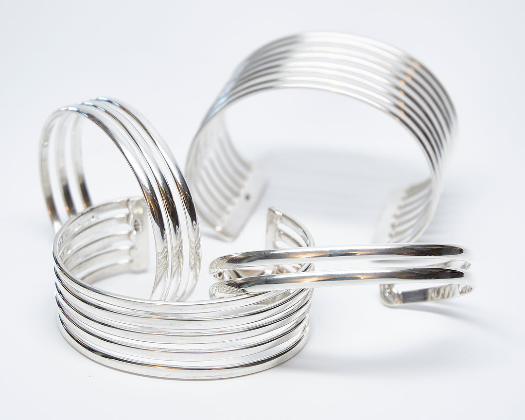 Two Straight Band Silver O'Keeffe Cuff and other cuffs
