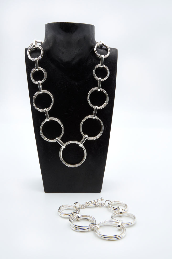 Graduated Interlinked Circle Silver Bracelet and Necklace