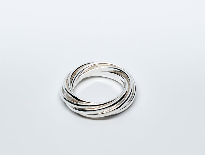 Seven interlinked sterling silver bands ring with a playful rolling design by Renata Rubio 92.5