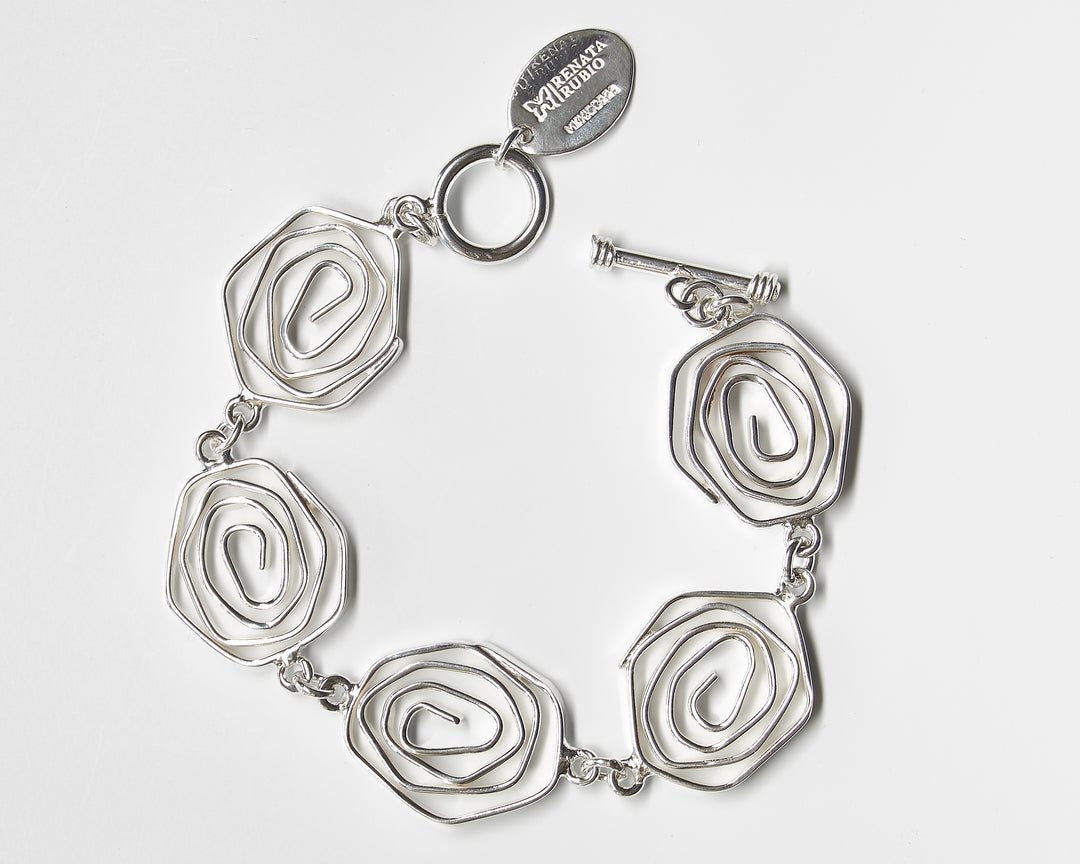 Labyrinth sterling silver bracelet by Renata Rubio 92.5 – handcrafted, adjustable, and intricately coiled artisan silver jewelry.