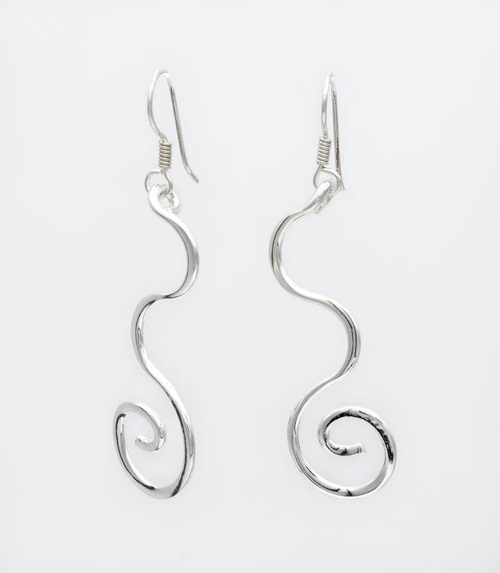 Curled sterling silver dangle earrings with a high-polish finish by Renata Rubio 92.5