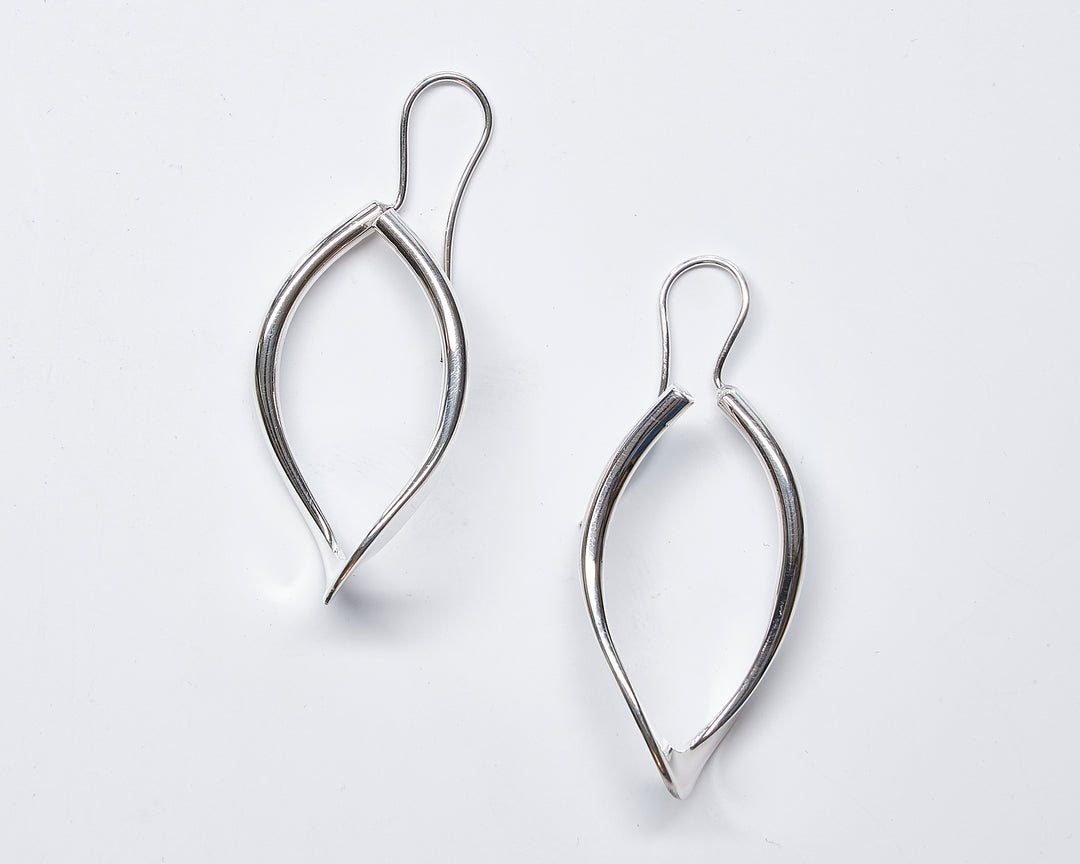 Elegant open leaf sterling silver earrings with a modern design by Renata Rubio 92.5 - Handmade sterling silver jewelry with a lifetime warranty.