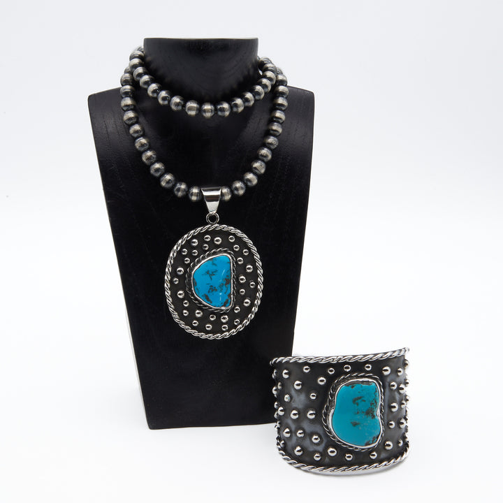 Oxidized silver pendant and bracelet by Renata Rubio 92.5, featuring Sleeping Beauty turquoise.