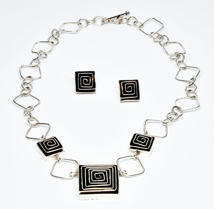 Oxidized sterling silver maze post earrings and necklace with a high-shine finish by Renata Rubio 92.5 - Handmade sterling silver jewelry with a lifetime warranty.