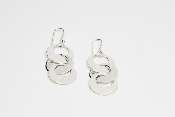 Pounded silver trio dangle earrings by Renata Rubio 92.5 – handcrafted, interlinked, and elegantly polished artisan jewelry.