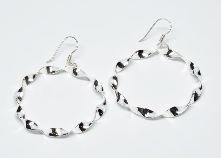 Twisted sterling silver round loop dangle earrings with a classic, handcrafted design by Renata Rubio 92.5