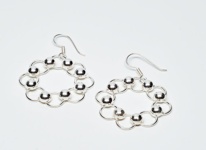 Sterling silver loop and bead dangle earrings with a high-polish finish by Renata Rubio 92.5 - Handmade sterling silver jewelry with a lifetime warranty.