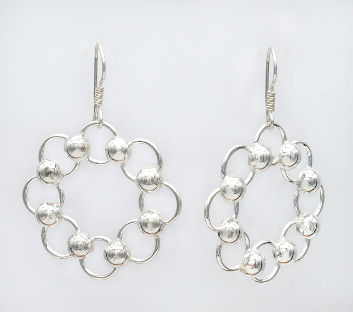 Sterling silver loop and bead dangle earrings with a high-polish finish by Renata Rubio 92.5 - Handmade sterling silver jewelry with a lifetime warranty.