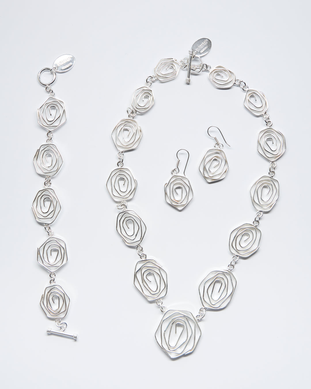 Labyrinth sterling silver set of necklace, dangle earrings and bracelet by Renata Rubio 92.5 – handcrafted, adjustable, and intricately coiled artisan silver jewelry.