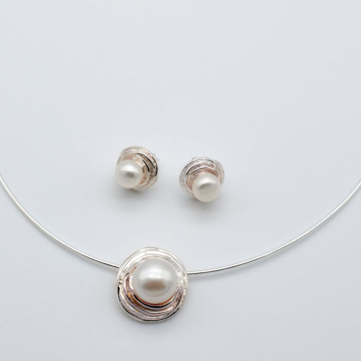 Pearl necklace and Sterling Silver Nest Button Pearl Earrings and Pendant, handmade elegantly designed artisan jewelry.  Renata Rubio 92.5 Handmade fine sterling silver jewelry with a lifetime warranty. 