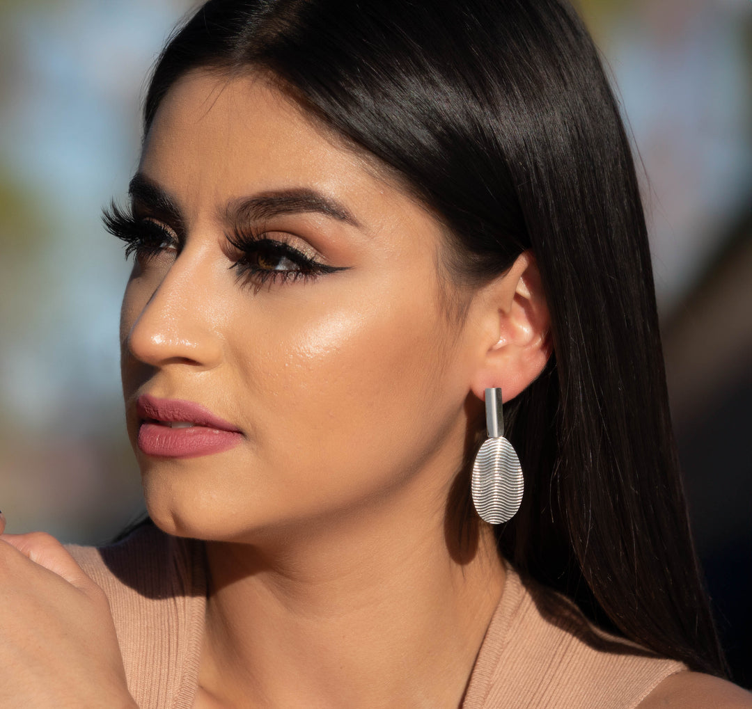 Oval Textured Silver Earrings on Model