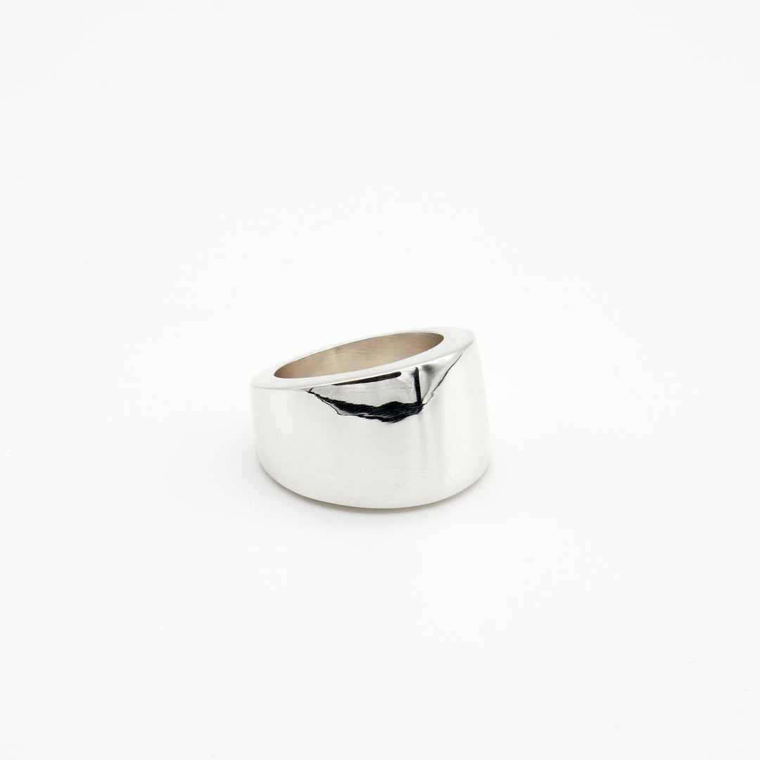 Thick tapered sterling silver ring with a high-polish finish and bold flat surface. Artisan-crafted by Renata Rubio 92.5