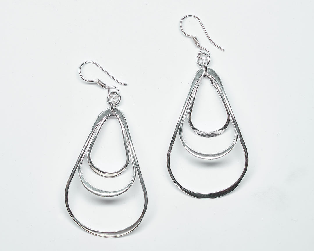 Modern triple pear sterling silver earrings with a sleek design by Renata Rubio 92.5 -Handmade sterling silver jewelry with a lifetime warranty.