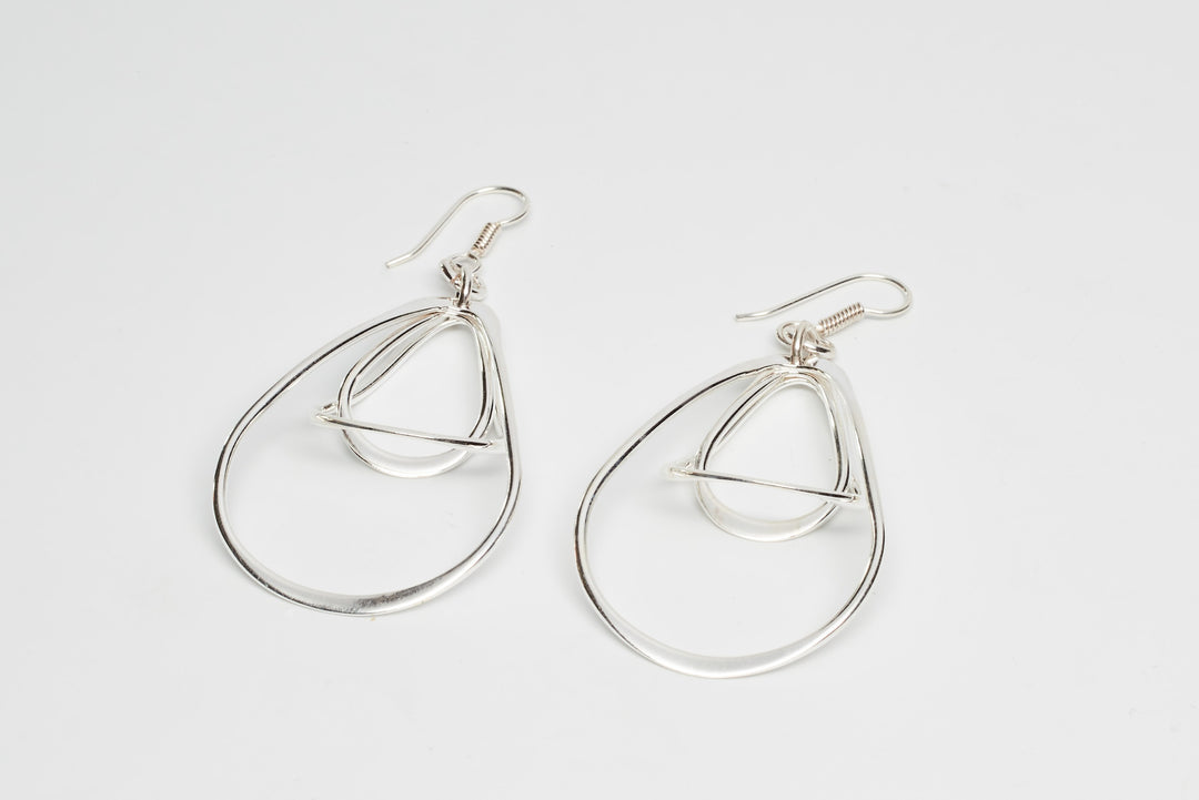 Modern triple pear sterling silver earrings with a sleek design by Renata Rubio 92.5 -Handmade sterling silver jewelry with a lifetime warranty.