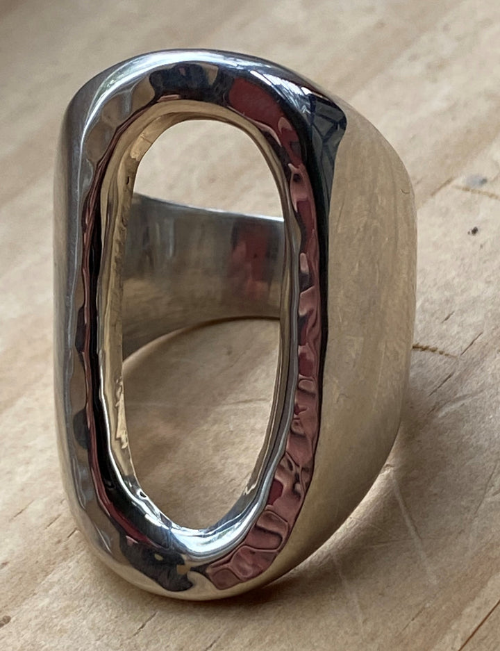 Hand-pounded sterling silver open oval ring with a bold design by Renata Rubio 92.5